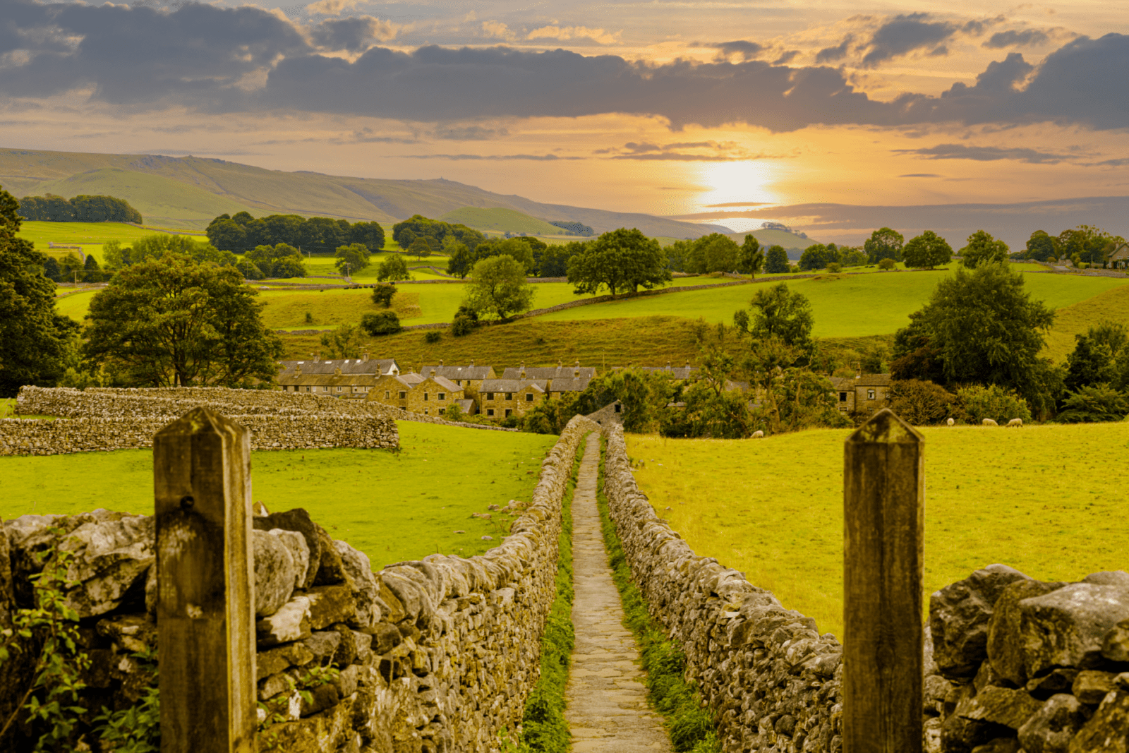 Country side view looking down a footpath with hills in the distance